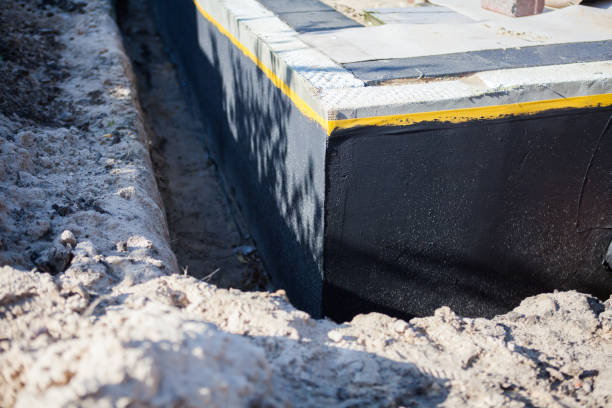 Professional Basement Waterproofing technician working in Alamo, TN